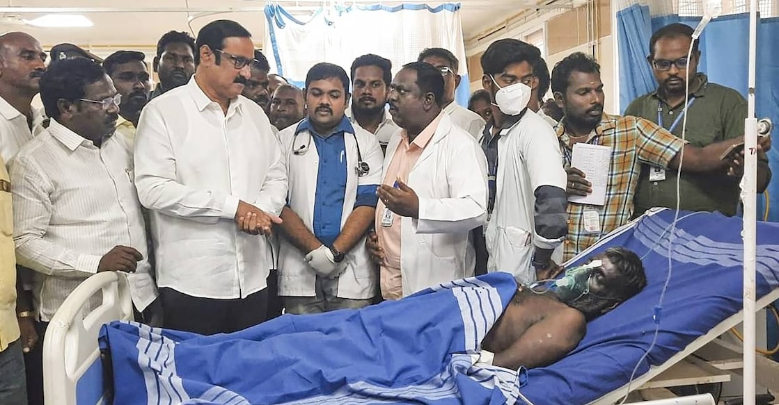Former union minister Anbumani Ramadoss speaks with medics at a government hospital where people who consumed spurious liquor are being treated, in Kallakurichi. Photo: PTI