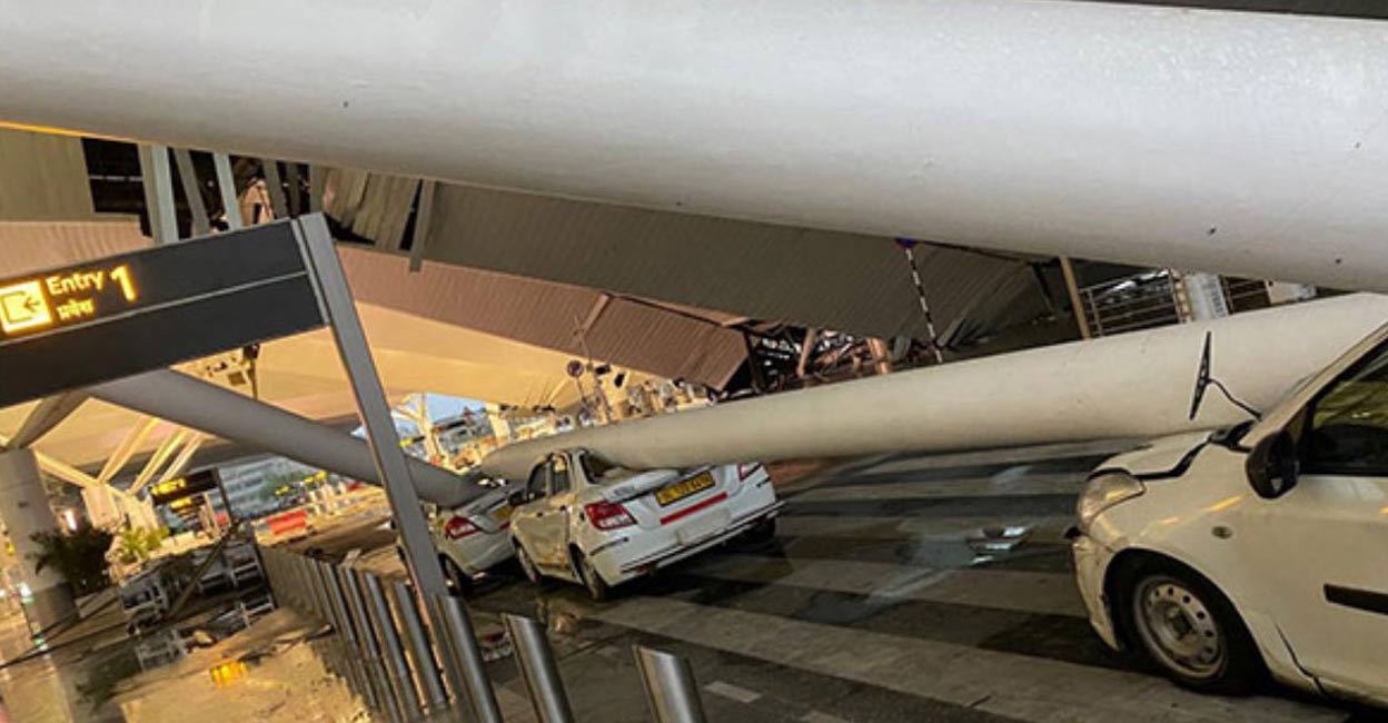 delhi-airport-roof-collapse-ls Besides the roof sheet, the support beams collapsed, damaging the cars parked in the pick-up and drop area of the terminal. Photo: @SaketGokhale/ X.