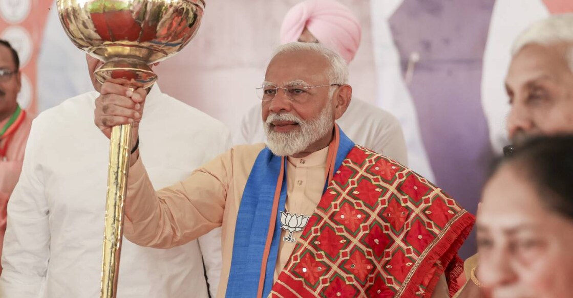 Prime Minister Narendra Modi holds a mace at a public meeting for the last phase of Lok Sabha elections, in Hoshiarpur, Punjab. Photo: PTI