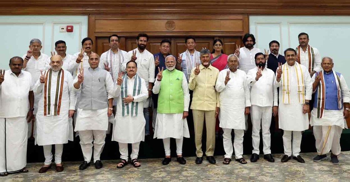In this photo shared by Prime Minister's Office, Indian Prime Minister Narendra Modi, center, poses for a photograph with senior leaders of the Bharatiya Janata Party (BJP) and to his left, Telugu Desam Party leader N Chandrababu Naidu, and Janata Dal (United) leader Nitish Kumar, during a meeting at his residence in New Delhi, India, Wednesday, June 5, 2024.