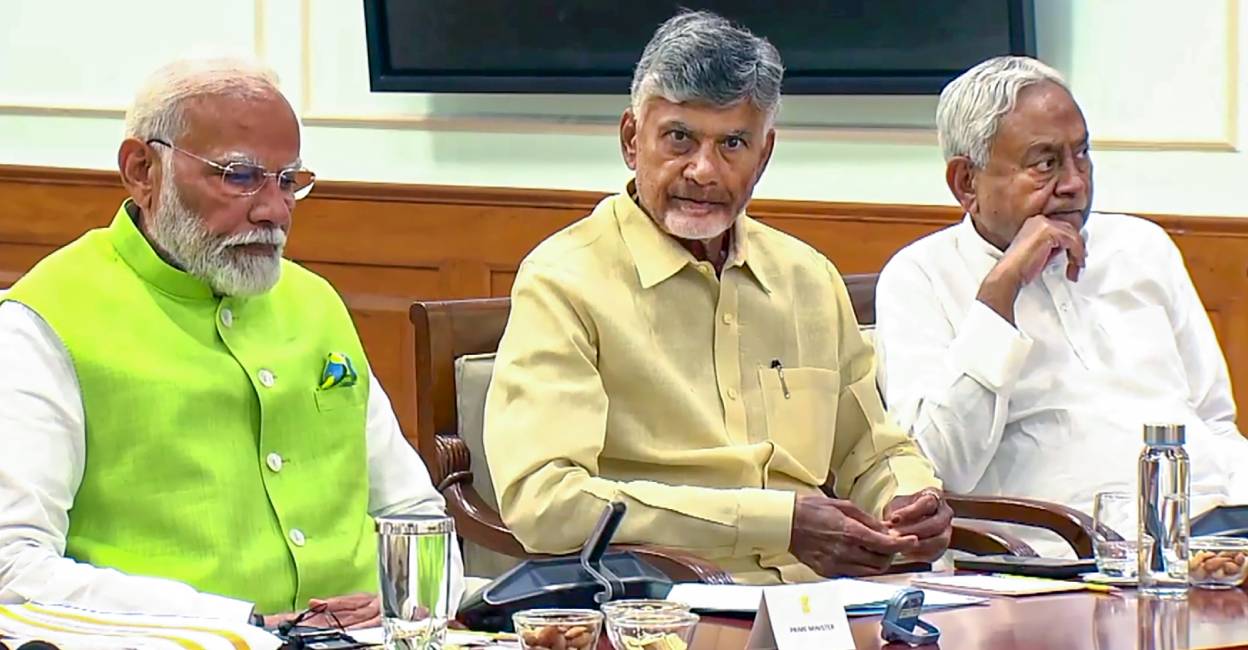 Narendra Modi with TDP leader Chandrababu Naidu and JDU leader Nitish Kumar. Photo: PTI