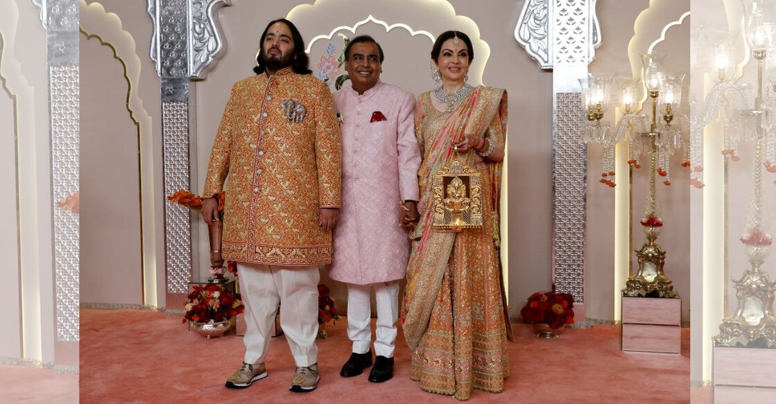 Groom Anant Ambani poses for pictures with Nita Ambani and Mukesh Ambani on the red carpet on the day of his wedding with Radhika Merchant in Mumbai, India, July 12, 2024. Photo: Reuters/Francis Mascarenhas