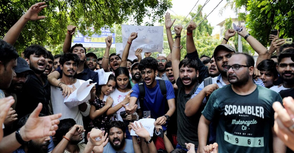 Students stage a protest over the death of three civil services aspirants after the basement of a coaching centre was flooded by rainwater, in New Delhi, Sunday, July 28, 2024. Photo: PTI. 