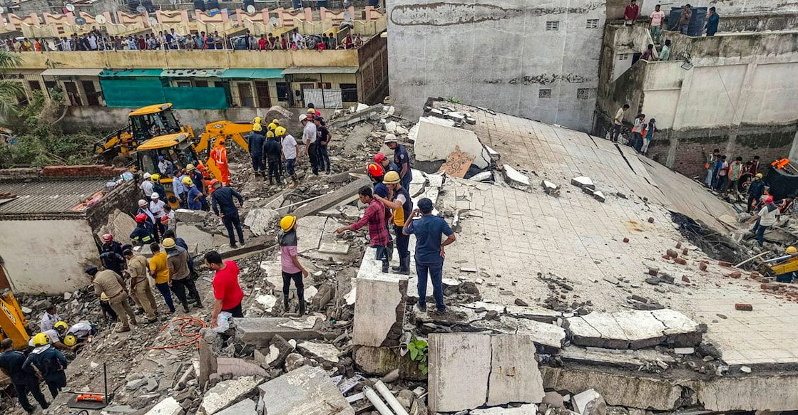 PTI07_06_2024_000266B A rescue operation is ongoing after a building collapsed in Surat, Gujarat on Saturday. Photo: PTI