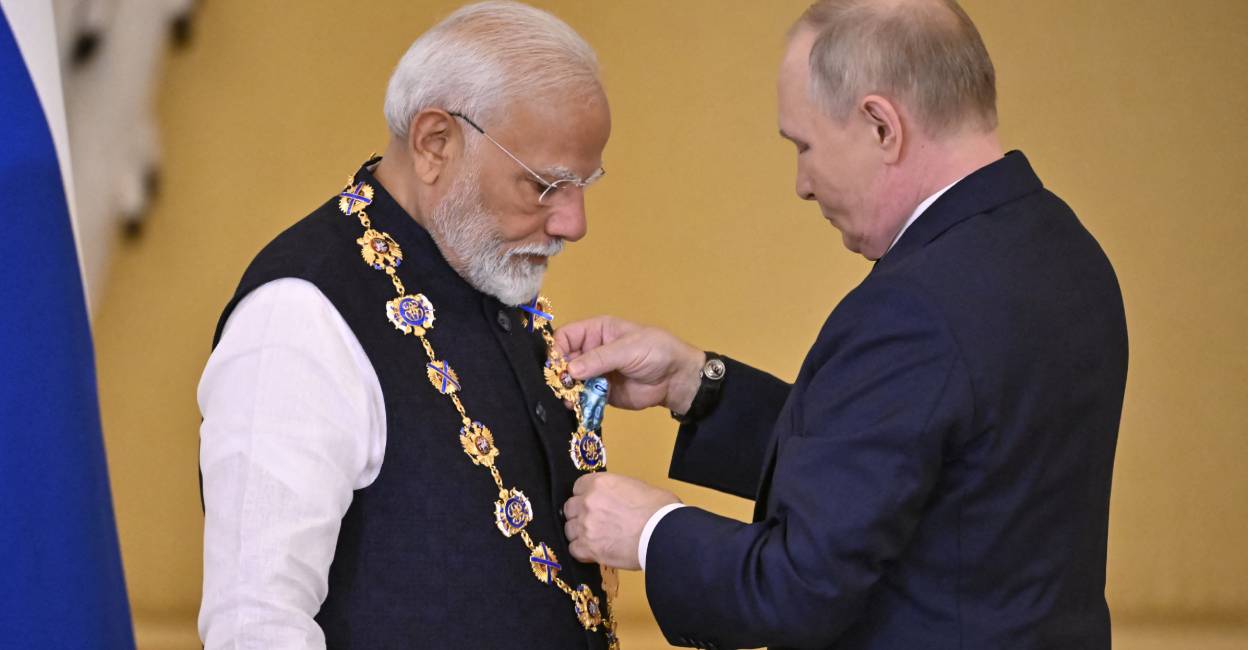 Russian President Vladimir Putin decorates Indian Prime Minister Narendra Modi with the Order of St. Andrew the Apostle the First-Called during a ceremony following their talks at the Kremlin in Moscow. Photo: AFP