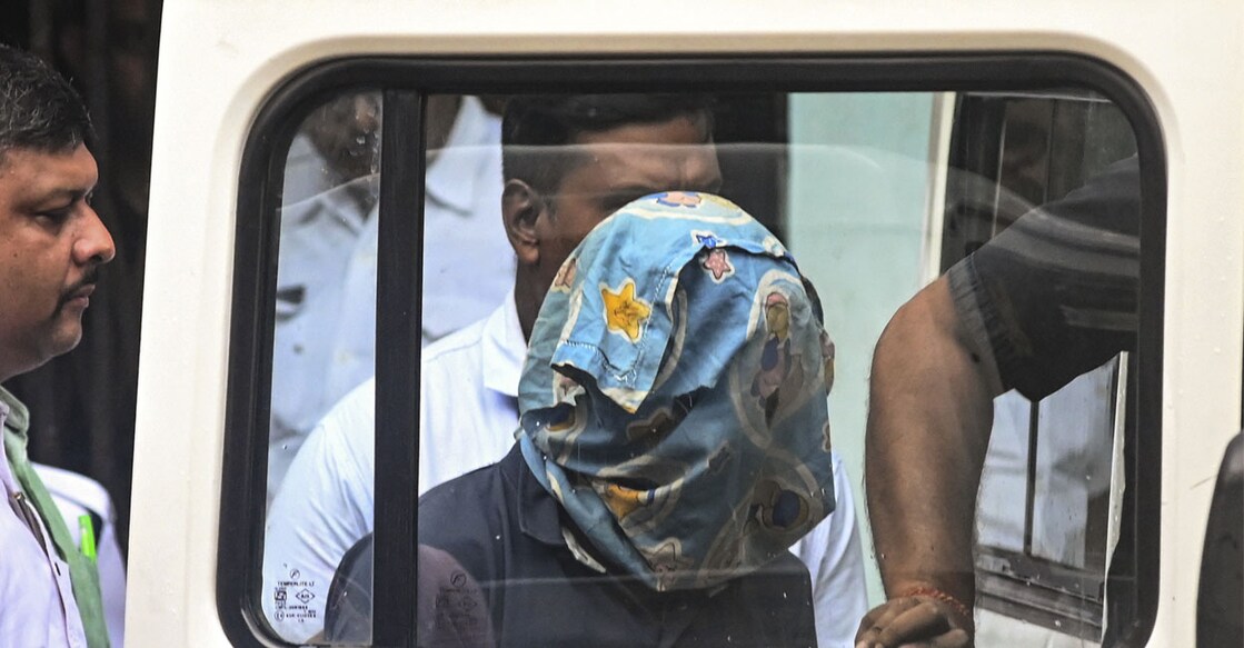 Police personnel with the accused arrested in connection with the alleged rape and murder of a woman trainee doctor at RG Kar Medical College and Hospital