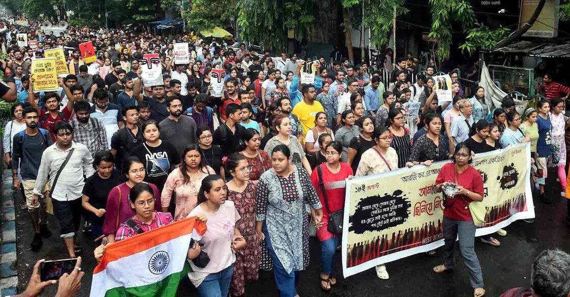 Doctors protest during a rally against the alleged rape and murder of a trainee doctor at the RG Kar Medical College and Hospital, at Shyambazar, in Kolkata, Sunday, Aug. 18, 2024. Photo: PTI