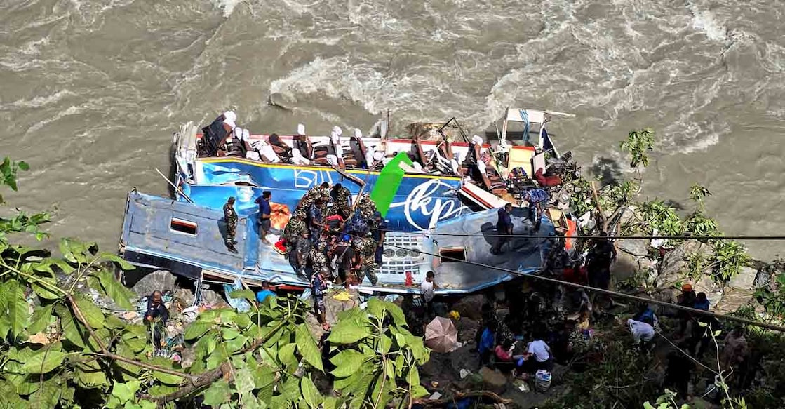 Security force personnel work to rescue injured passengers after a bus carrying Indian passengers traveling to Kathmandu from Pokhara plunged into a river in Tanahun District, Gandaki Province, Nepal August 23, 2024. REUTERS/Stringer