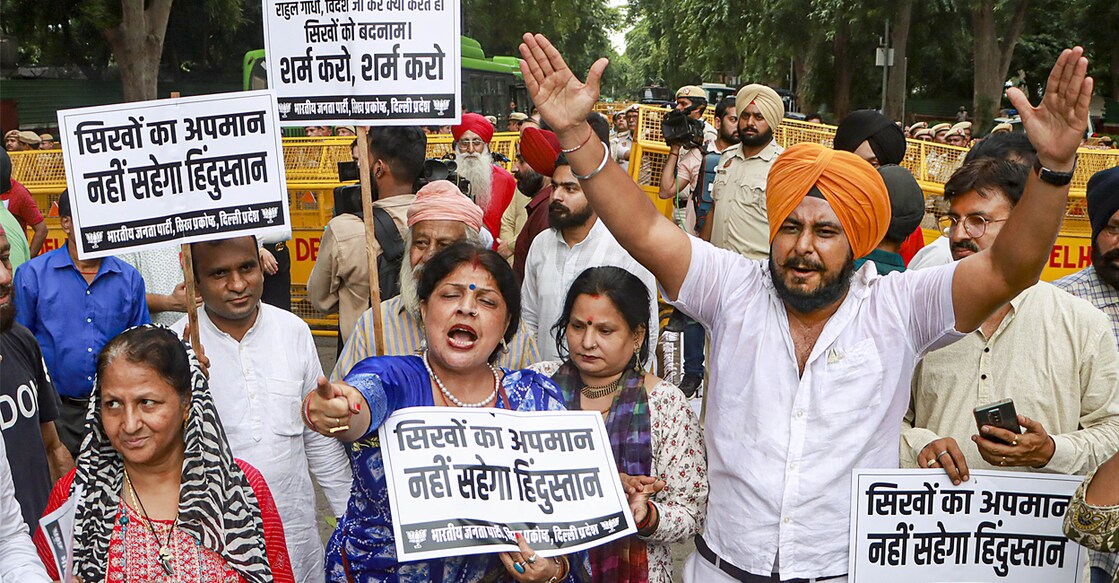 Members of a Sikh group stage a protest march outside the residence of Congress leader Sonia Gandhi, in New Delhi. Photo: PTI