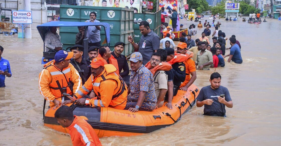 City Police Commissioner IPS SV Rajasekhara Babu with others reviews the rescue operation at a flood-affected area after heavy rainfall, in Vijayawada. File Photo/ PTI. 