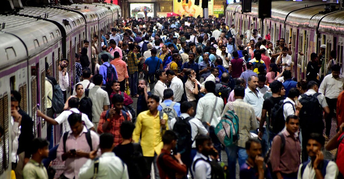 Commuters stranded at Chhatrapati Shivaji Terminus (CSMT) as local train services got delayed due to rain in Mumbai on Wednesday. Photo: PTI