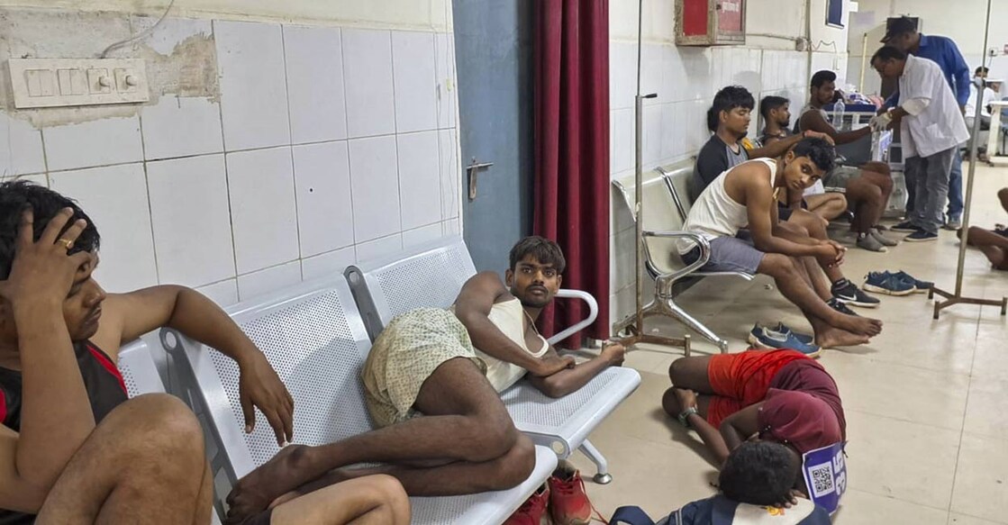jharkhand-recruitment-ls Youths, who came for a recruitment rally, lie on the ground of a hospital while receiving treatment, in Palamu, Monday, Sept. 2, 2024. At least 12 youths died during the recruitment rally of Product Constable across Jharkhand State. Photo: PTI.
