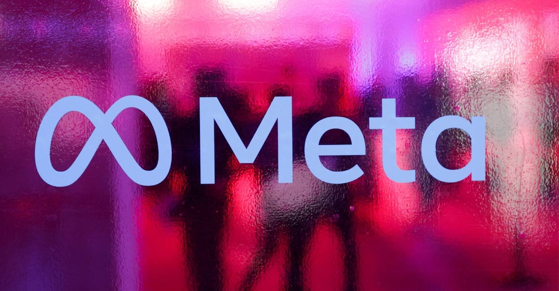People walk behind a logo of Meta Platforms company during a conference in Mumbai, India. File Photo: Reuters. 