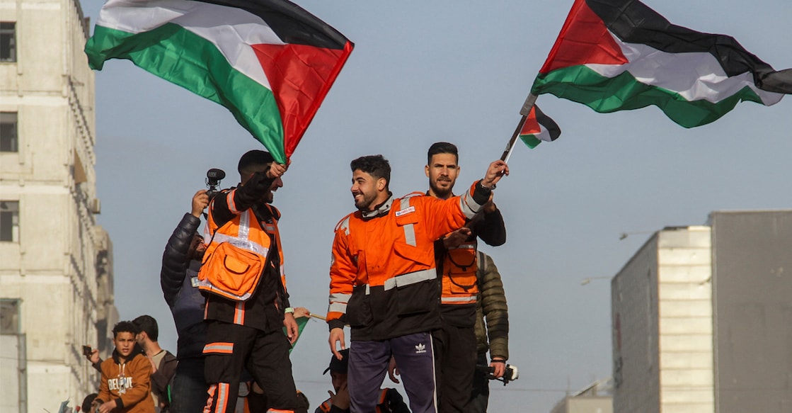 Members of the Palestinian civil emergency service celebrate in Gaza City. Photo: Reuters/Mahmoud Issa