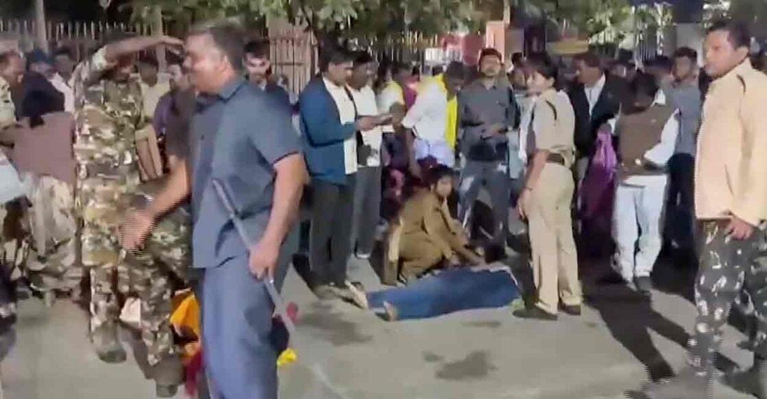 Police personnel and people gather around a person injured in a stampede-like situation which broke out near Vaikuntha Dwara Darshan ticketing center during distribution of tokens as devotees rushed for 'darshan', in Tirupati, Andhra Pradesh, Wednesday, Jan 9. Photo: PTI