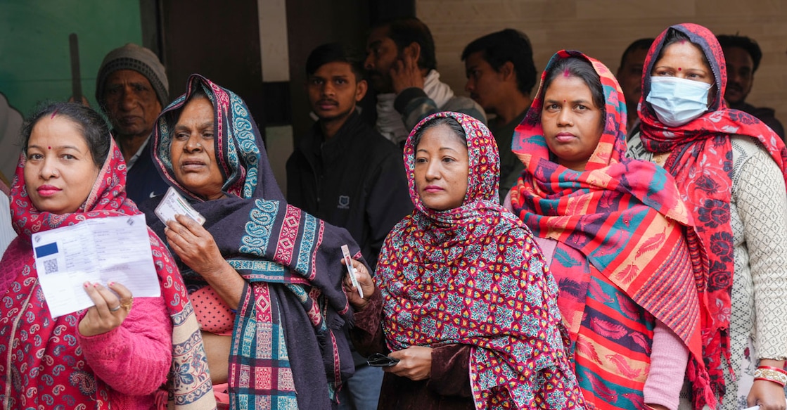 PTI02_05_2025_000526B Voters wait in a queue to cast their votes at a polling station during the Delhi Assembly elections, at Trilokpuri area, in New Delhi, Wednesday, Feb. 5, 2025. Photo: PTI