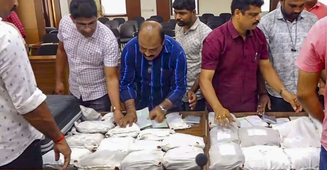 Police personnel display seized drugs during a press conference in Mangaluru. Photo: PTI