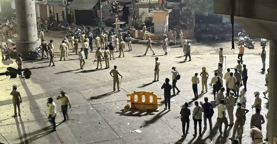 Police disperse an agitating crowd as communal tension prevailed Chitnis park area following the VHP-Bajrang Dal protest, in Nagpur. Photo: PTI