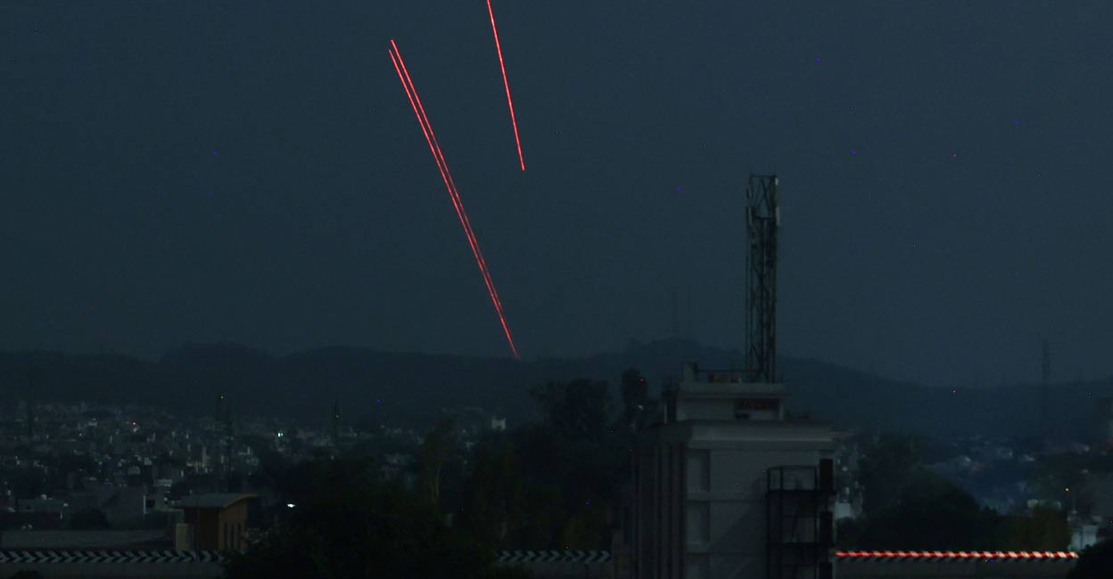 Trails from an Indian air defence system are seen above Jammu during a Pakistani strike on May 9, 2025. Photo: AFP via PTI. 