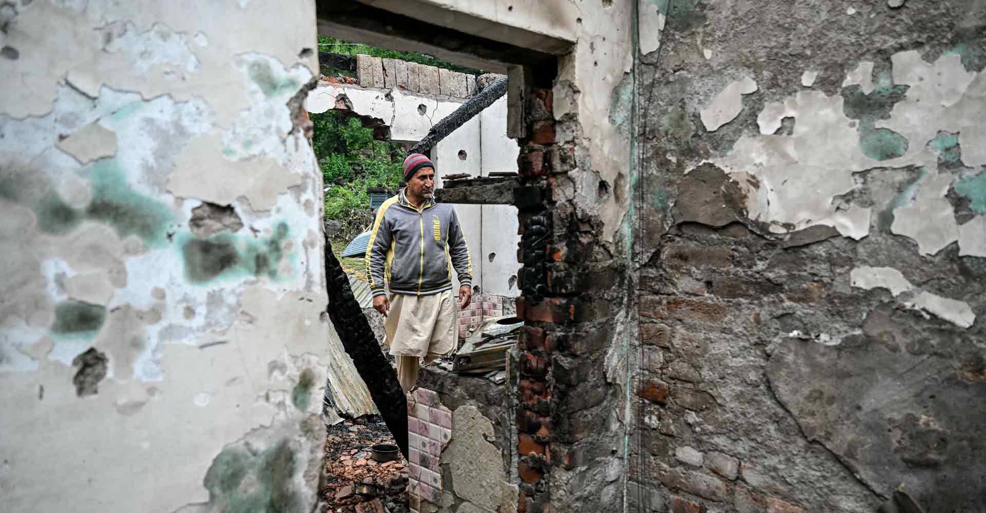INDIA-PAKISTAN-KASHMIR-UNREST A man walks through his house destroyed by Pakistani artillery shelling at the Salamabad village in Uri, about 110kms from Srinagar, on May 8, 2025. Photo: AFP/Sajjad Hussain
