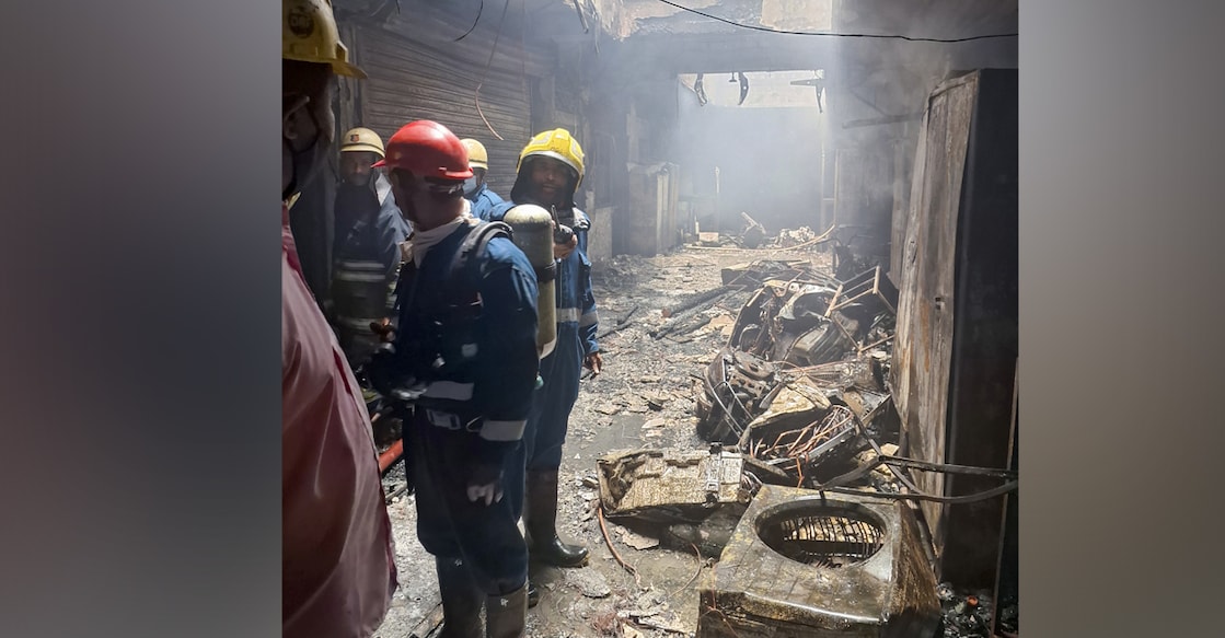 Firefighters at the site after a fire broke out in a building near Gulzar House in the Old City area of Hyderabad. 