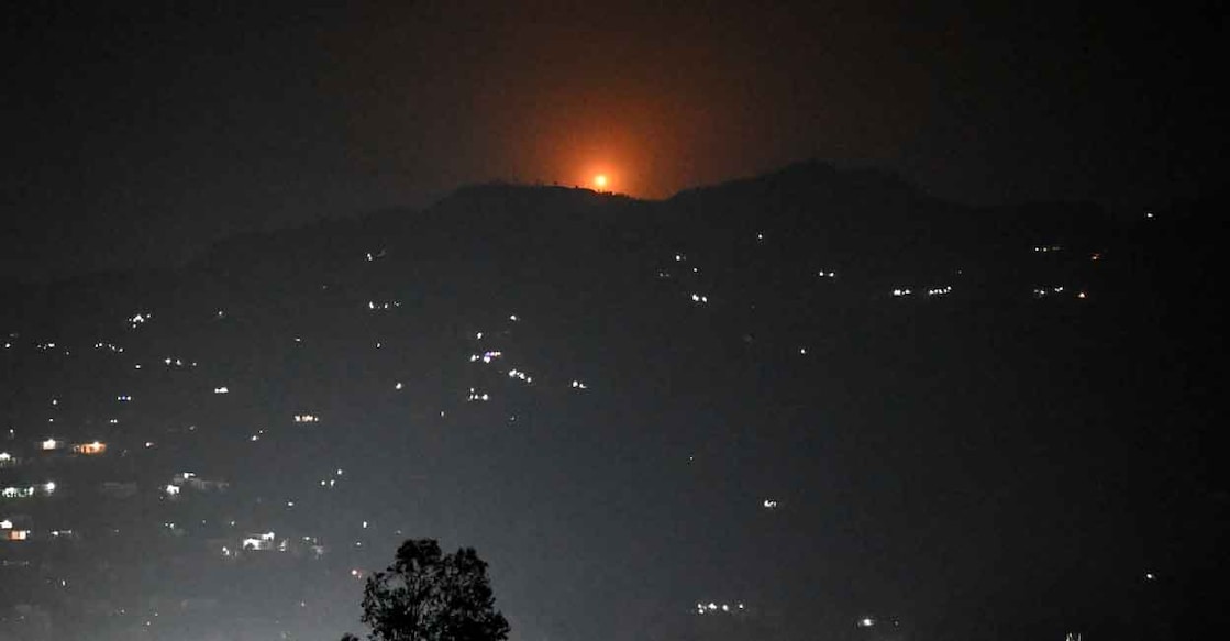 A flare goes up in air over the hill near main town of Poonch district, on May 7, 2025. India said on May 7 it carried out 'precision strikes at terrorist camps' inside Pakistan and Pakistani-controlled Kashmir, days after it blamed Islamabad for a deadly attack on the Indian side of the contested region. Photo: Punit PARANJPE / AFP