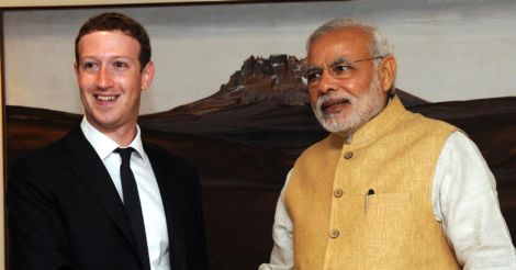 Prime Minister Narendra Modi (R) meets with Facebook founder and CEO Mark Zuckerberg in New Delhi on October 10, 2014.AFP