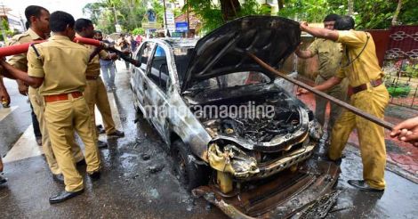 Moving car catches fire in Kollam