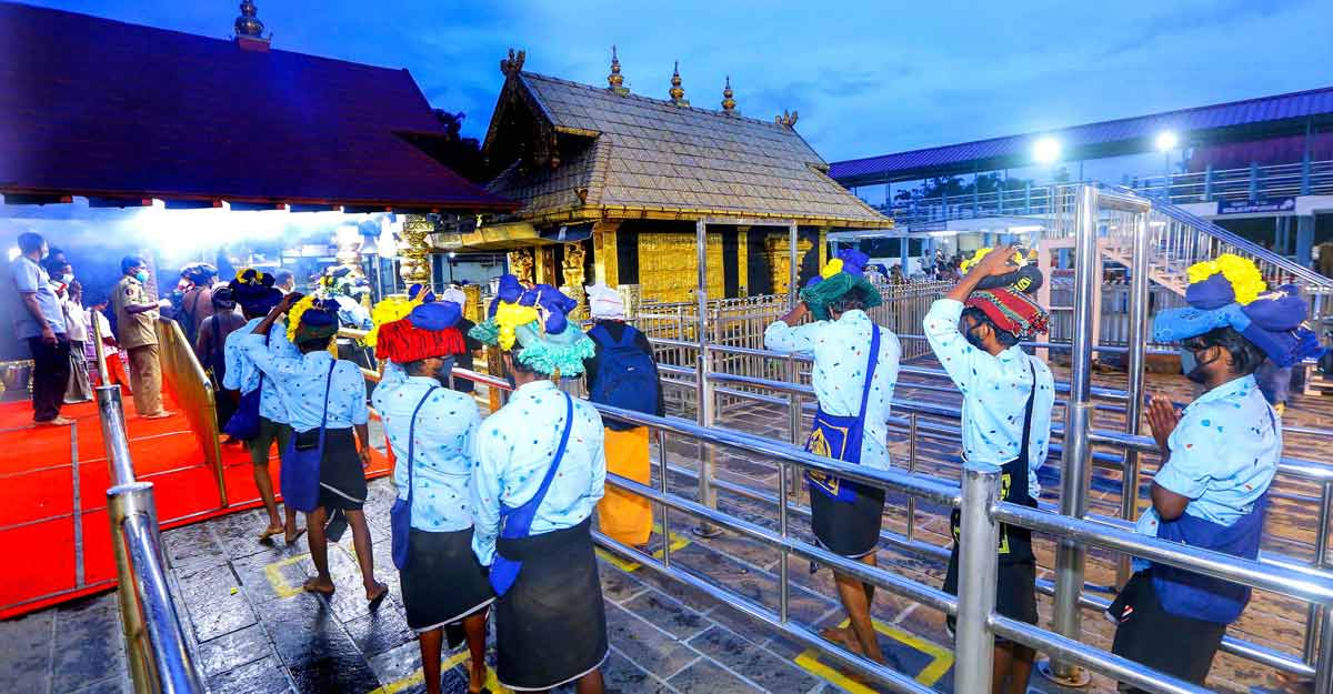 Adhering to COVID-19 protocols, devotees trek Sabarimala Adhering to COVID-19 protocols, devotees trek Sabarimala