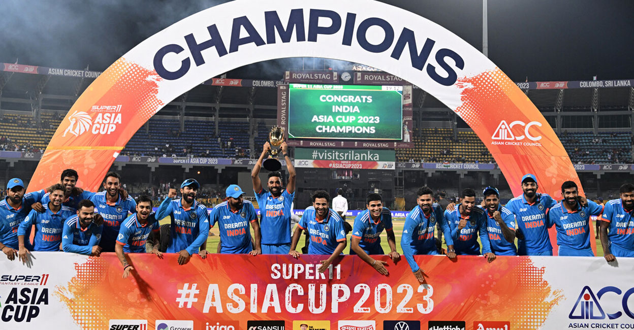 India’s players celebrate with the trophy after winning the Asia Cup 2023 at the R. Premadasa Stadium in Colombo on Sunday. Photo: AFP/ Farooq Naeem