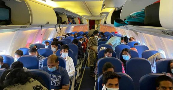 NRKs aboard the Vande Bharat flight to India amid the COVID pandemic NRKs aboard the Vande Bharat flight to India amid the COVID pandemic