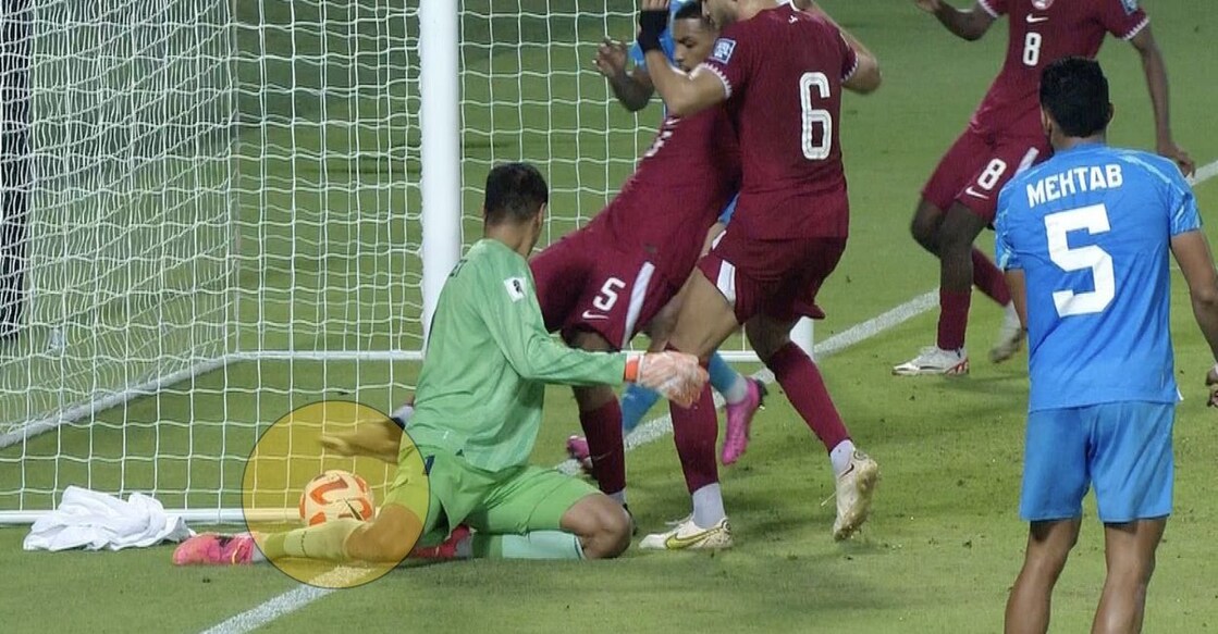 The ball (highlighted) is being dragged into play by Qatar's Hashmi Al Hussain as Indian goalkeeper Gurpreet Singh Sandhu looks on. Photo: Screengrab/Fancode live