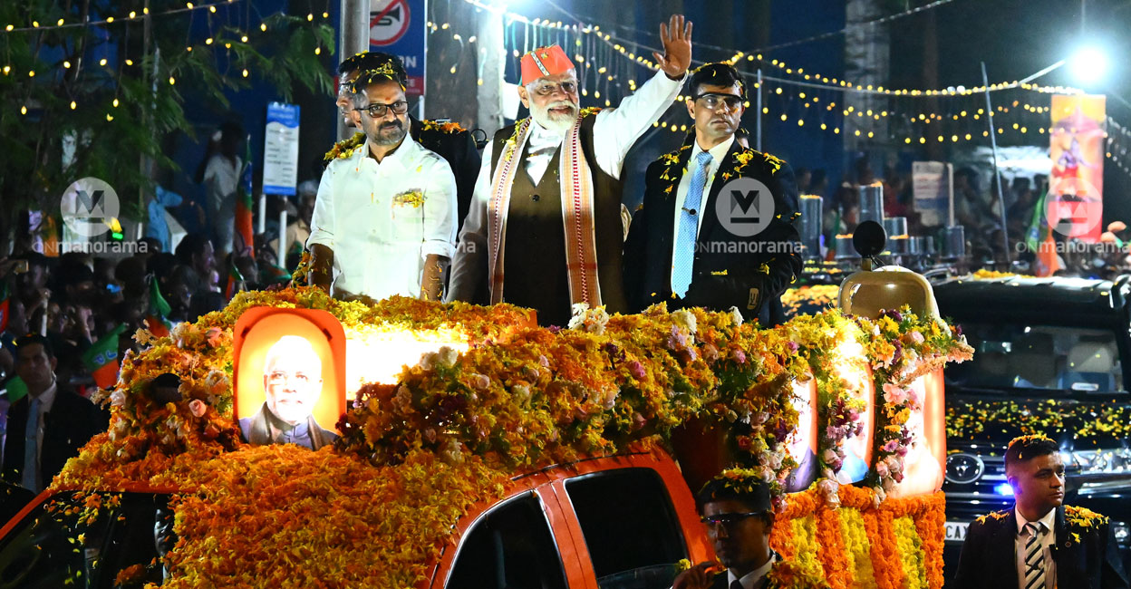 Prime Minister Narendra Modi with BJP Keralam president K Surendran during a roadshow in Kochi on Tuesday. Photo: Tony Dominic/Manorama