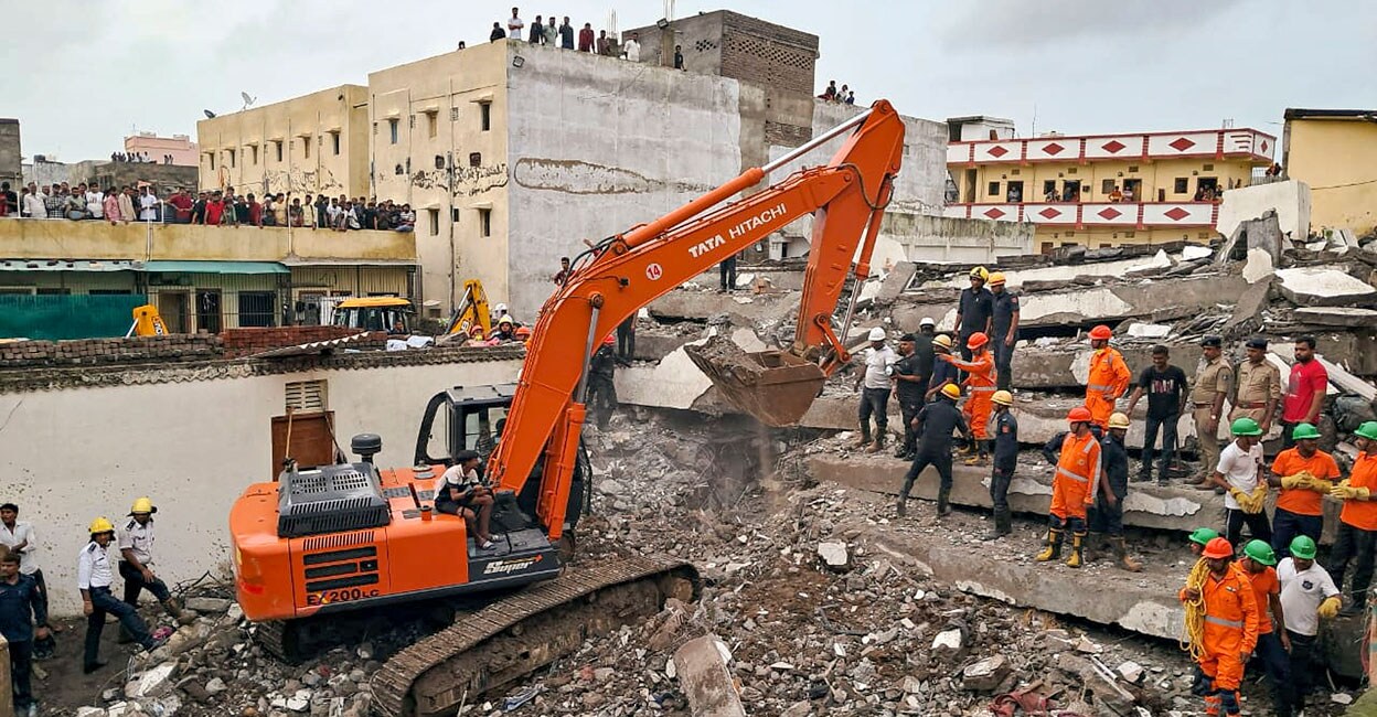 From the rescue operations on the site where a six-storey building collapsed. Photo: PTI