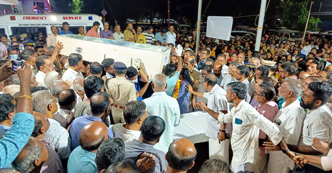 People of Kalikkadavu in Kasaragod gather as the mortal remains of Kunhikelu Ponmaleri is brought to his house on Friday. Photo: Special arrangement