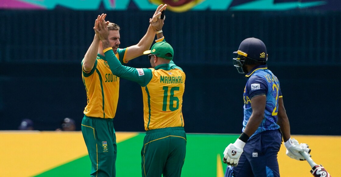 Anrich Nortje and Keshav Maharaj celebrate the wicket of Sri Lanka's Kamindu Mendis during the ICC men's T20 World Cup group D match at Nassau County International Cricket Stadium in East Meadow, New York on Monday. Photo: AFP/Timothy A Clary