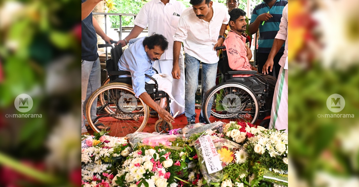 oommen-chandy-tomb-flower-tribute People on wheelchairs offer tributes at the tomb of Oommen Chandy at St George Orthodox Church at Puthuppally in Kottayam.