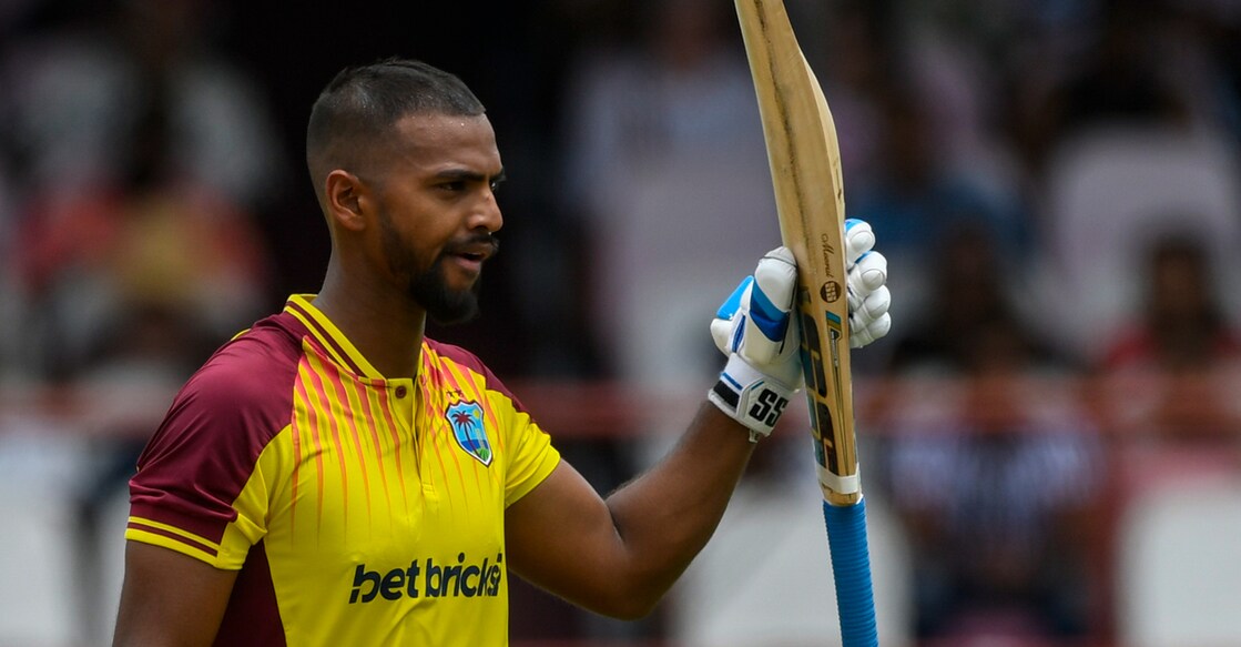 Nicholas Pooran of the West Indies celebrates his half century during the 2nd T20I match against India at Guyana National Stadium in Providence on Sunday. Photo: AFP/Randy Brooks