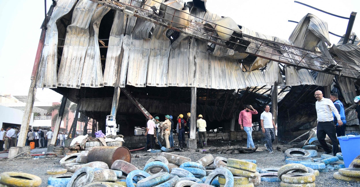 INDIA-ACCIDENT-FIRE Firefighters try to extinguish a fire which broke out at an amusement park facility in Rajkot. Photo: AFP