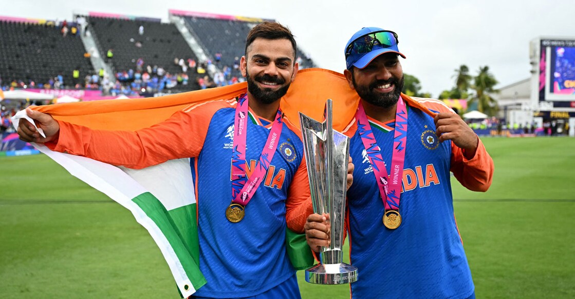 India's Virat Kohli and captain Rohit Sharma celebrate with the trophy after winning the ICC men's Twenty20 World Cup. Photo: AFP/Chandan Khanna

