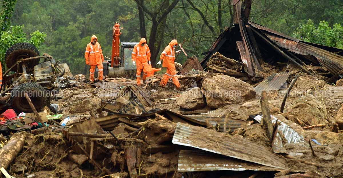 Rescue workers at a landslide site in Kerala. File Photo