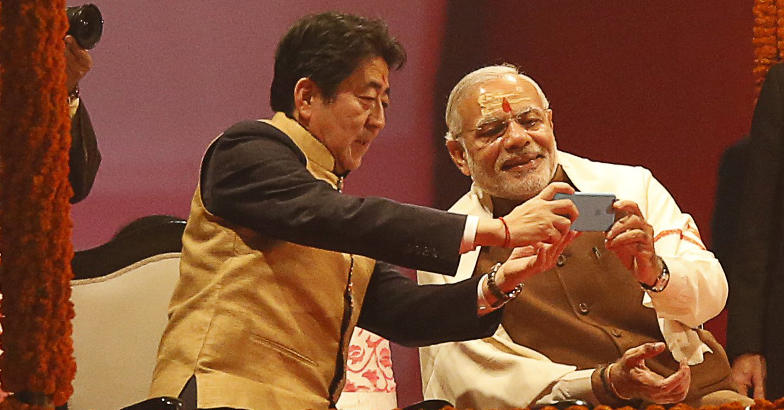 Shinzo Abe, Narendra Modi selfie Japan's Prime Minister Shinzo Abe (L) and his Indian counterpart Narendra Modi take a selfie as they attend a ritual known as "Aarti" during evening prayers on the banks of the river Ganges at Varanasi, India, December 12, 2015. Reuters