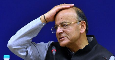 Under fire, GST council eases burden on small companies, cuts tax rates on 27 items
