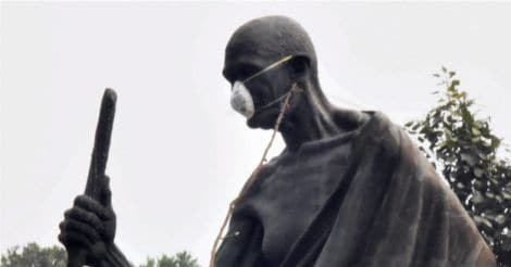 Delhi smog: MLAs tie protective mask on Mahatma Gandhi's statue  