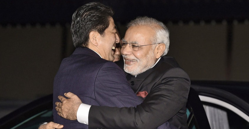 Modi Japan’s Prime Minister Shinzo Abe hugs Modi upon his arrival at the state guesthouse in the Japanese city of Kyoto. Photo: AFP