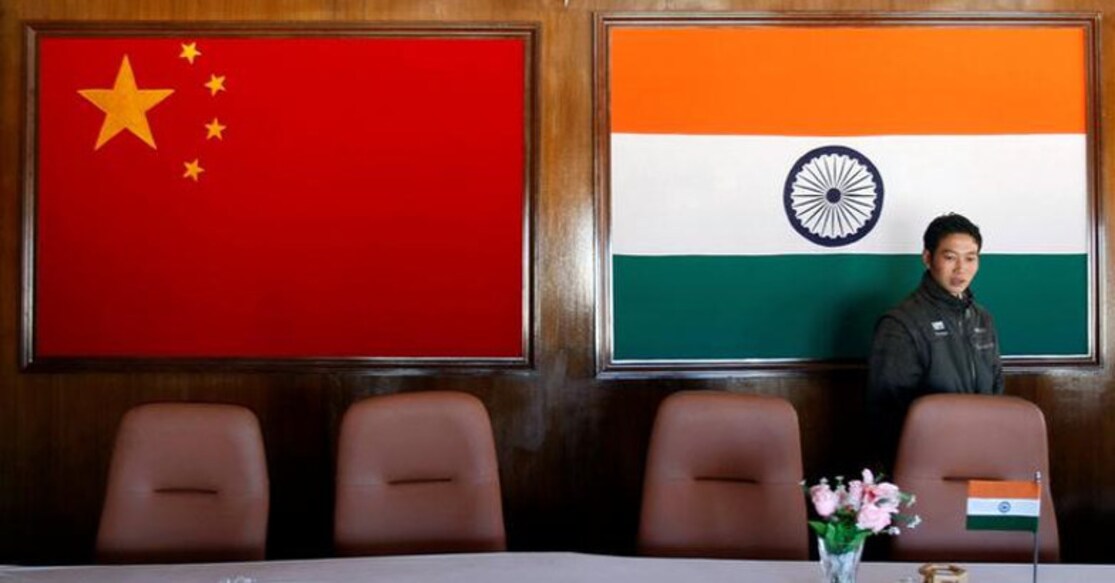 A man walks inside a conference room used for meetings between military commanders of China and India, at the Indian side of the Indo-China border at Bumla, in Arunachal Pradesh, November 11, 2009. REUTERS/Adnan Abidi/Files