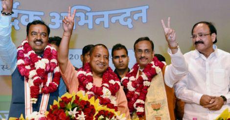 BJP's  Yogi Adityanath (C) elected leader of the BJP Legislature Party (Chief Minister Uttar Pradesh)  K P Muriya (L Deputy CM) and Dinesh Sharma (R Deputy CM) showing victory sign after the meeting  in Lucknow on Saturday.PTI