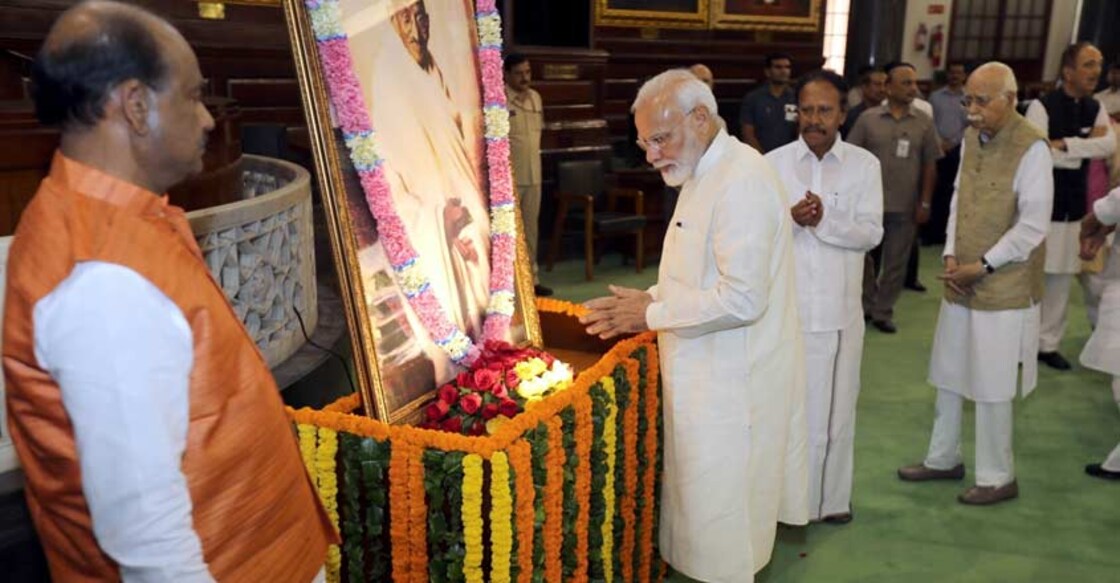 New Delhi: Prime Minister Narendra Modi pays tribute to the portrait of Mahatma Gandhi on his 150th birth anniversary at the Parliament House, in New Delhi Oct 2, 2019 (Photo: Amlan Paliwal/IANS) New Delhi: Prime Minister Narendra Modi pays tribute to the portrait of Mahatma Gandhi on his 150th birth anniversary at the Parliament House, in New Delhi Oct 2, 2019 (Photo: Amlan Paliwal/IANS)