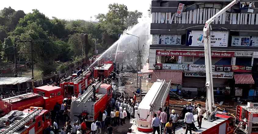 Firefighters attempt to douse the fire. Firefighters attempt to douse the fire.