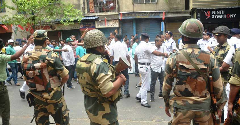Jadavpur: Police and CRPF personnel control the situation after scuffle broke out between Trinamool Congress (TMC) and Bharatiya Janata Party (BJP) workers at Bijaygarh of Jadavpur, in West Bengal on May 23, 2019. (Photo: IANS) Jadavpur: Police and CRPF personnel control the situation after scuffle broke out between Trinamool Congress (TMC) and Bharatiya Janata Party (BJP) workers at Bijaygarh of Jadavpur, in West Bengal on May 23, 2019. (Photo: IANS)